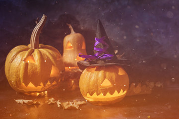Scary Halloween pumpkin on a black background. Scary glowing face trick or treat