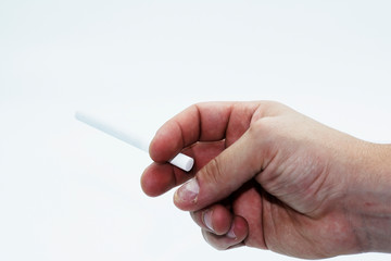 A close up of a a man holding a cigarette isolated on a white background