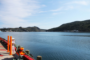 Panoramic view of st. John's Harbour, looking out from the dock toward the Narrows, Signal Hill, The Southside Hills, and the small boat basin. 