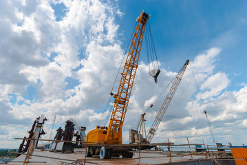 Fototapeta na wymiar Mobile crane at the construction site.