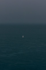 buoy in river at the rainy day