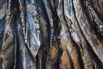 Close-up of a carved stone artifact. Exclusive texture. Concrete carving. Manual work