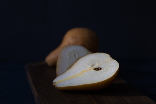 Yellow pear dark background  Natural healthy vegetarian food.