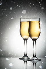 Two elegant glasses with sparkling champagne
