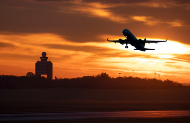 Fototapeta na wymiar Aircraft early take off at sunrise, Budapest airport
