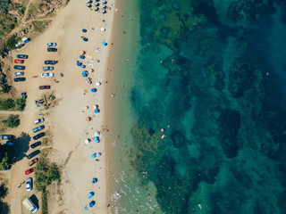 Fototapeta na wymiar Beach with sun beds, view from above