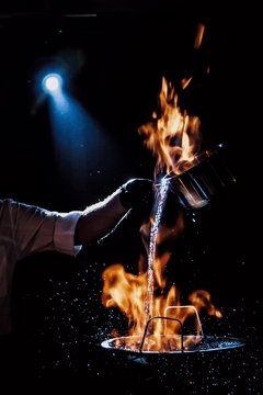 the cook makes a fire show.