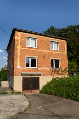 Fototapeta na wymiar Typified red brick family Bata houses in Zlin, Moravia, Czech Republic, sunny summer day