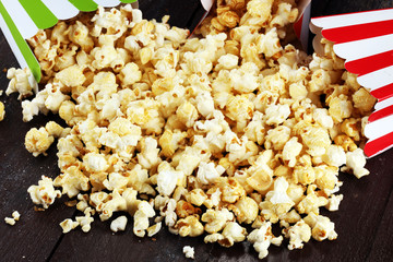 Cinema concept with popcorn in green white bag.