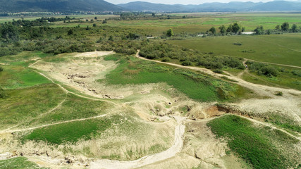 Swallow hole (sink, sinkhole, ponor) Rešeto and Vodonos on Cerknica Polje (Cerkniško polje), Slovenia is a point where waters from the surface submerge into cave system of karst.