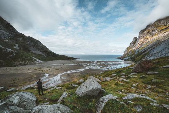 Hiking impressions at Bunes sand beach with view to Bunes Fjorden at Lofoten Islands in Norway on a blue sky with clouds sunny day.