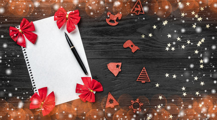 Black background of Xmas. Letter for Santa Claus. Toys and red toys. Space for text. Top view....