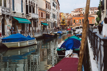 Venetian canals, old houses and moored boats