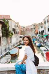 Fototapeta na wymiar young girl walks the streets of Venice