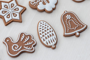 Ginger cookies on light wooden table as background