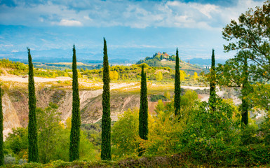Cypresses framing Montaio and Valdarno
