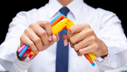 Businessman hand break plastic straws, people ban and stop using plastics garbage for better beach and sealife environment concept