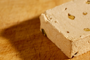 A block of American style Halavah with pistachios.