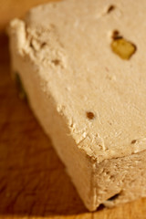 A block of American style Halavah with pistachios.