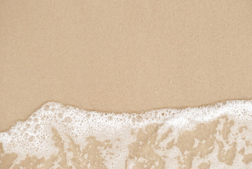 Sea wave on the sandy beach