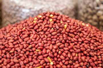 Peanuts exposed for sale on the market. Food photography, closeup.