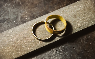 jewelry making at the jeweler’s workplace.  blanks of wedding rings made of yellow and white gold...