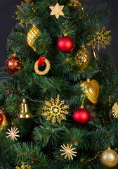 Fototapeta na wymiar Decorations in the Scandinavian style on an artificial Christmas tree