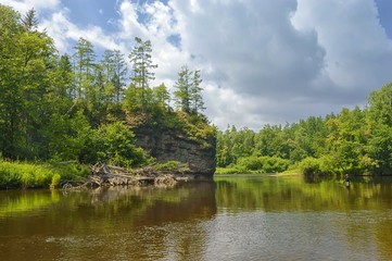 Fototapeta premium Fishing on the taiga river. Zeva river. Ussuri taiga, national park Bikin. Primorsky Krai, far East, Russia.