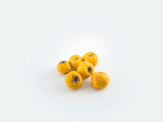 Yellow hawthorn berry with leaf isolated on white background close up path