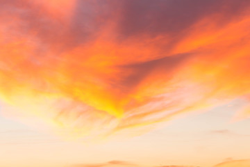 Clouds of beautiful color in the fall. Sunset pink red orange color.