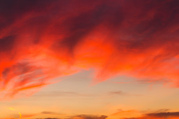 Clouds of beautiful color in the fall. Sunset pink red orange color.