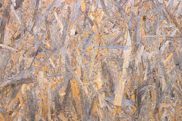 Texture of glued wood sawdust Board. 