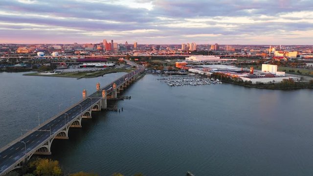 Sunset comes to Baltimore Maryland in this aerial view over harbor bridge