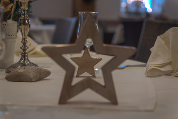 Christmas decorations on the table set the mood for the festive season. Concept: holidays and christmas