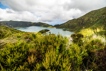 Lagoa do Fogo, a volcanic lake in Sao Miguel, Azores Island under the dramatic clouds