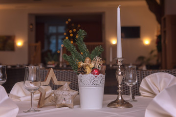 Christmas decorations on the table set the mood for the festive season. Concept: holidays and christmas