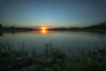 Fototapeta na wymiar A wonderful sunset on the banks of the river Oder. Concept: vacation and travel