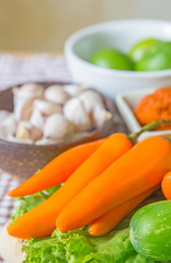 Fresh herbs and spices (chili, garlic, lettuce, lemon, cucumber)