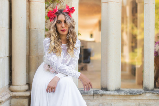 Portrait of beautiful blond girl in medieval dress with red diadem. Fairy tale scene