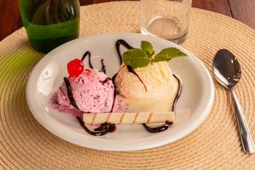 petit gateau delicious deocrado with cherry and mint.
