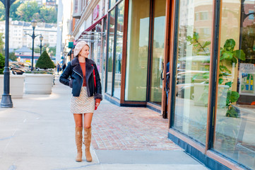 Beautiful woman with shopping bags walking at the mall