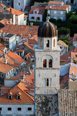 Obraz premium Bell tower of the Franciscan Church and Monastery in Dubrovnik, Croatia, originated in the 13th century, destroyed in the 1667 earthquake, rebuilt in the 17th century.