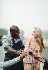 Gorgeous friends toasting at a summer party