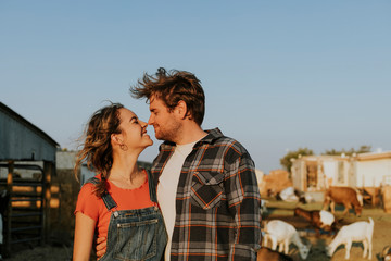 Portrait of a young happy couple at a farm