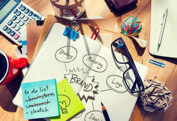 Brand drawn in a notebook on a messy table