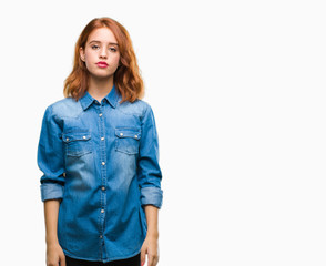 Fototapeta premium Young beautiful woman over isolated background with serious expression on face. Simple and natural looking at the camera.