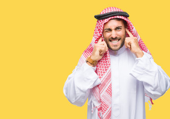 Young handsome man wearing keffiyeh over isolated background covering ears with fingers with...