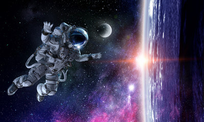 Fototapeta na wymiar Astronaut on space mission. Mixed media