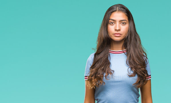 Young Beautiful Arab Woman Over Isolated Background With Serious Expression On Face. Simple And Natural Looking At The Camera.