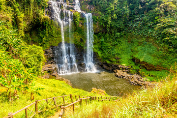 Beautiful view of waterfall landscape. Small waterfall in deep green forest scenery